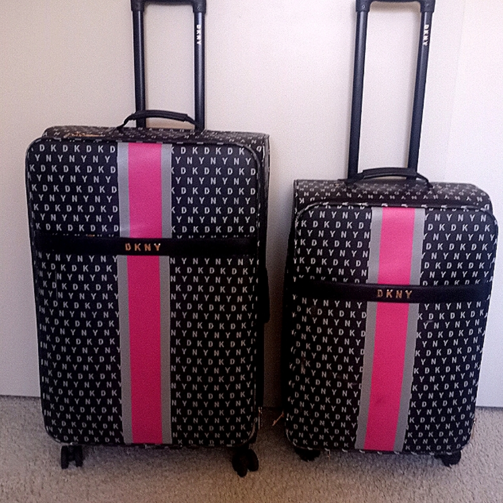 DKNY Luggage set, 28 inch and 24 inch spinners Pink on Black expandable.